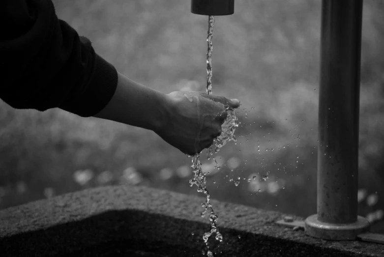 an image of a black and white water fountain