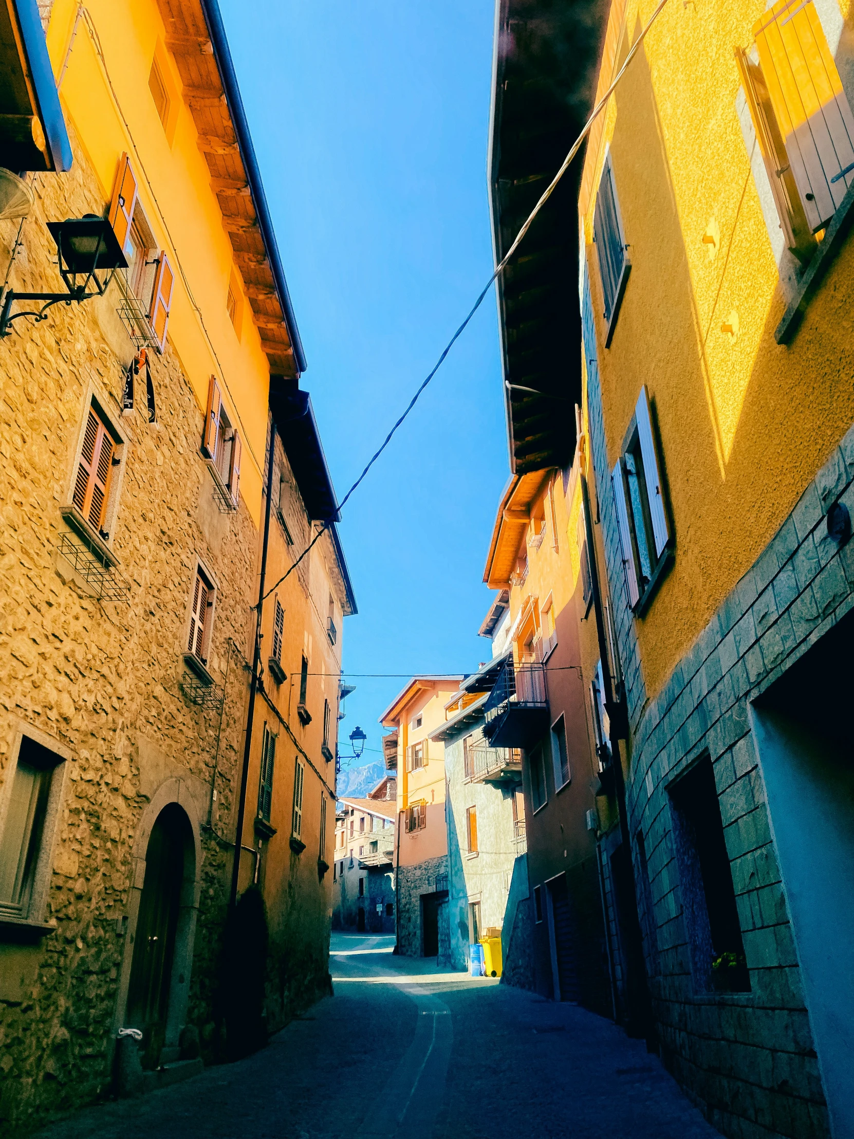 narrow streets with brick buildings on both sides