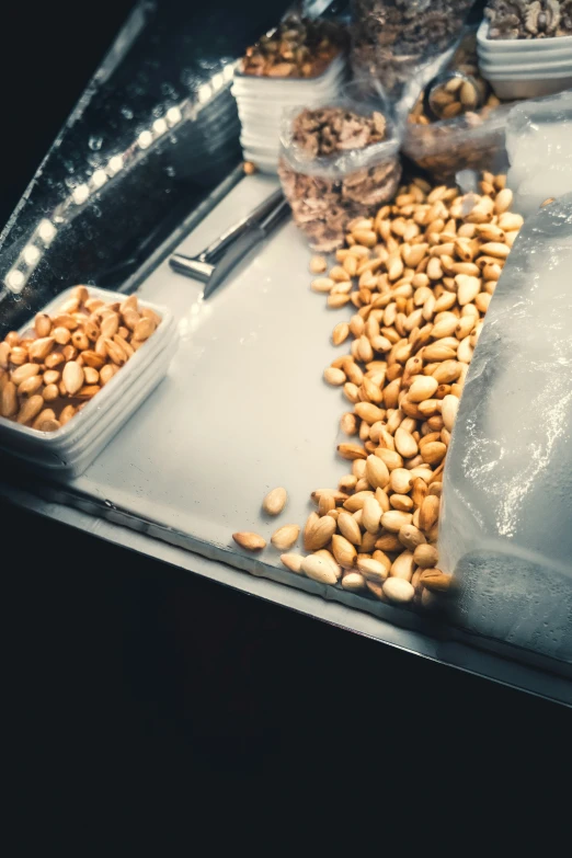 a metal tray with food in different containers