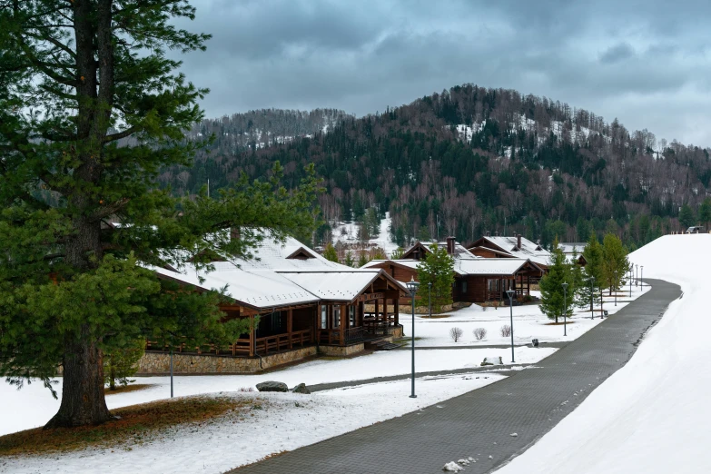 a ski lodge on a snowy hillside, with the ski area in focus