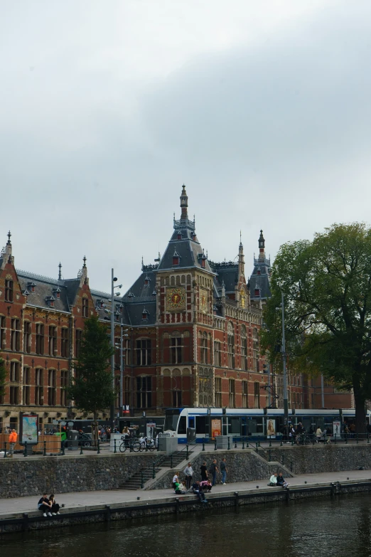 the city is next to a canal and a bus