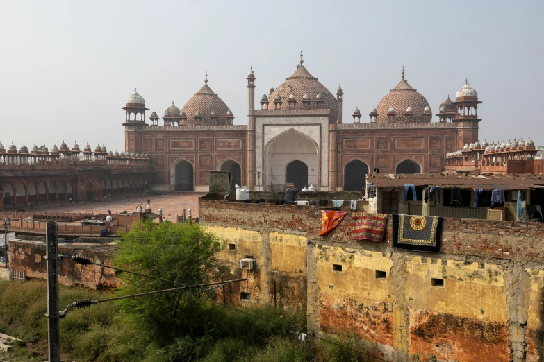 a large building with a long tower behind it