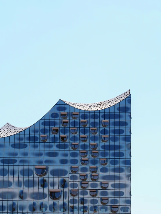 an office building with some sky in the background