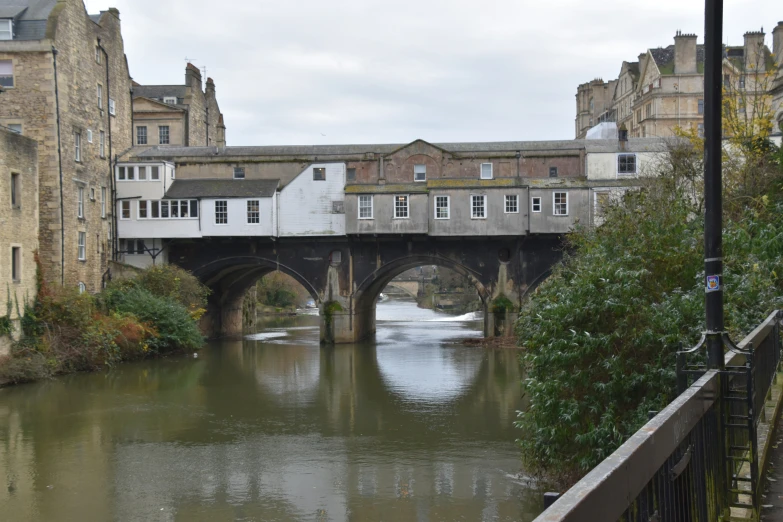 a water way and some buildings are in the background