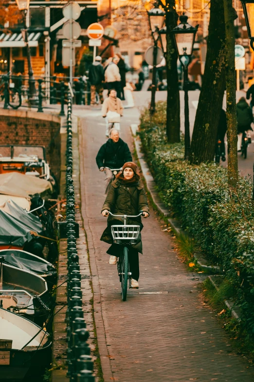 two people on bicycles going down a city street