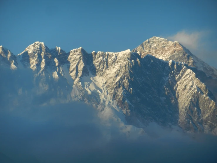 view of the top of a very tall mountain in the sky