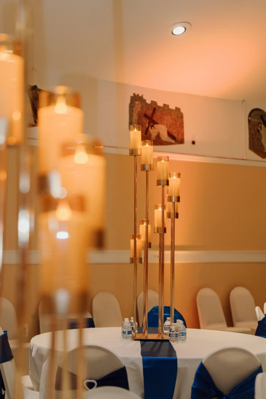 a well lit banquet room with chairs and tables