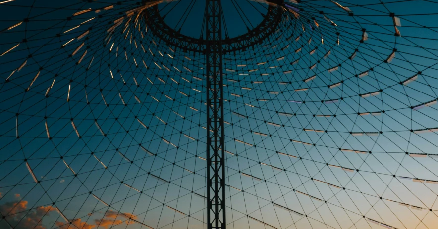 a large metal structure that is next to the sky