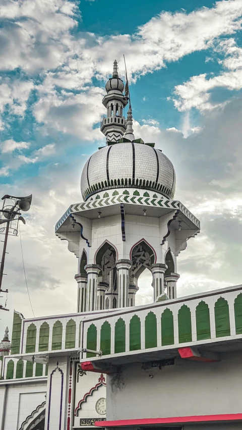 an outdoor structure sits under a cloudy sky