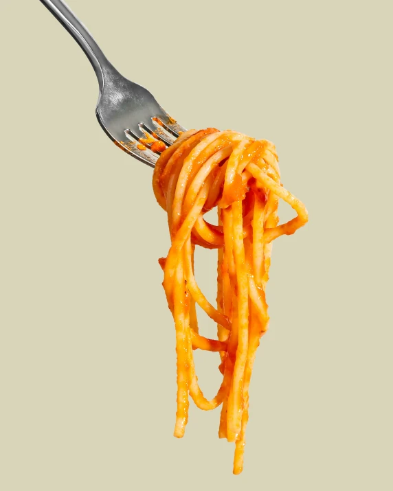 spaghetti on a fork being tossed into the air