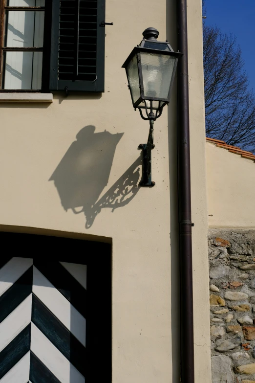 a lamp post is against an older building