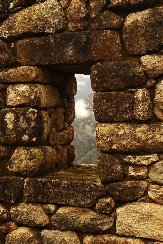 an open window in the stone wall at a castle