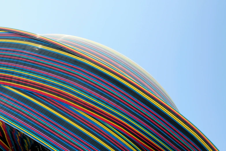 a large colorful art object near a building