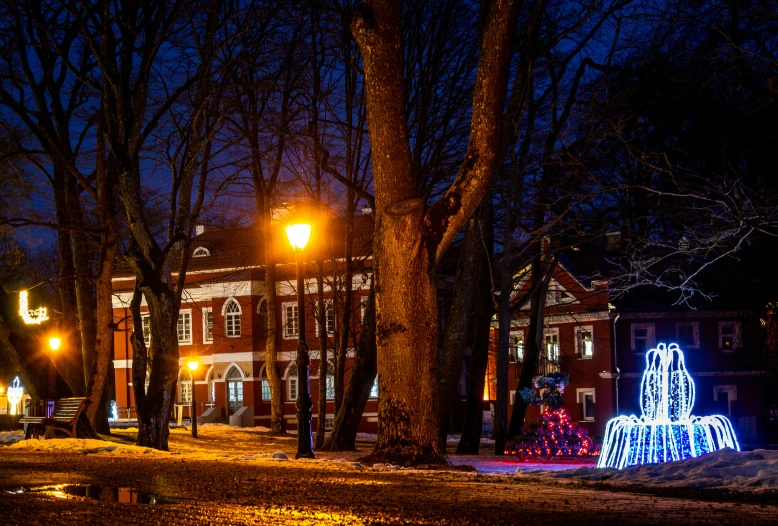 the christmas lights at the town square glow brightly