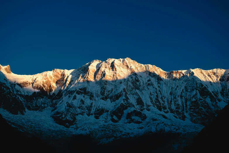 the snowy mountain peak is visible from below