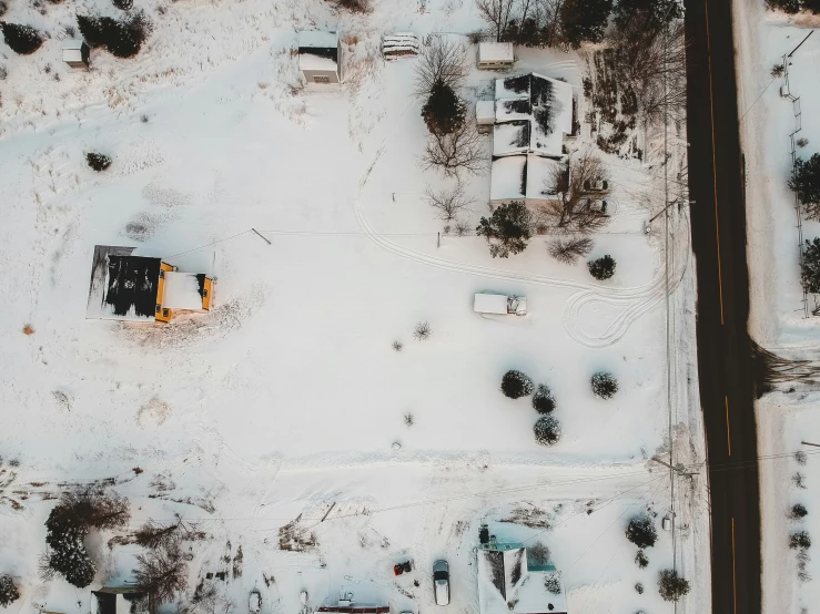 a parking lot with snow covering the ground