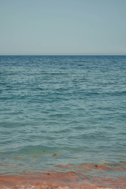 the view of an ocean from a beach shore