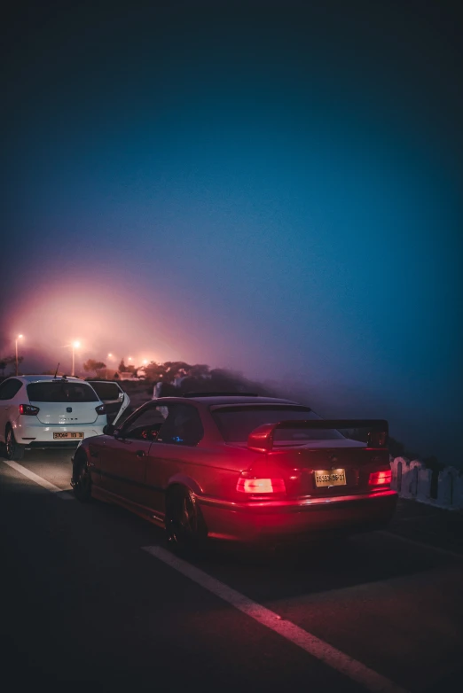 a car and a trailer stopped on the road