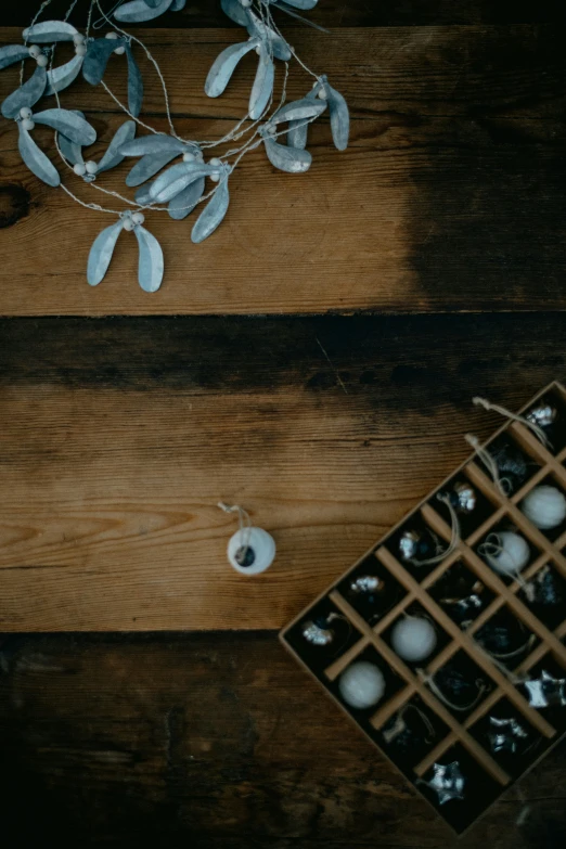 some decorations and a vase with flowers on top