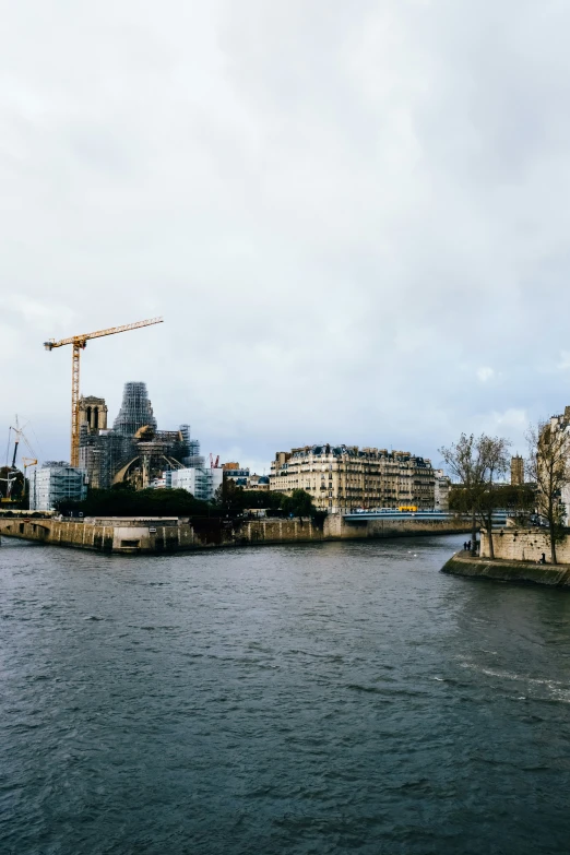 a body of water with buildings in the background