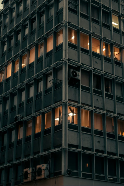 a large tall building with lots of windows in front of it