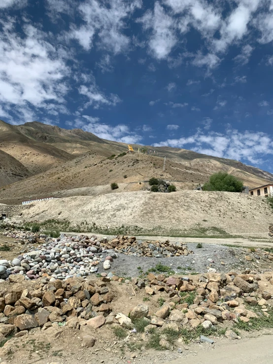 a dry grass covered hill on the side of a mountain