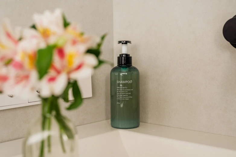 a vase with flowers in the corner of a bathroom