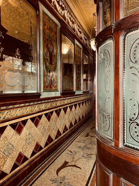 a room with a window and decorative wall tile