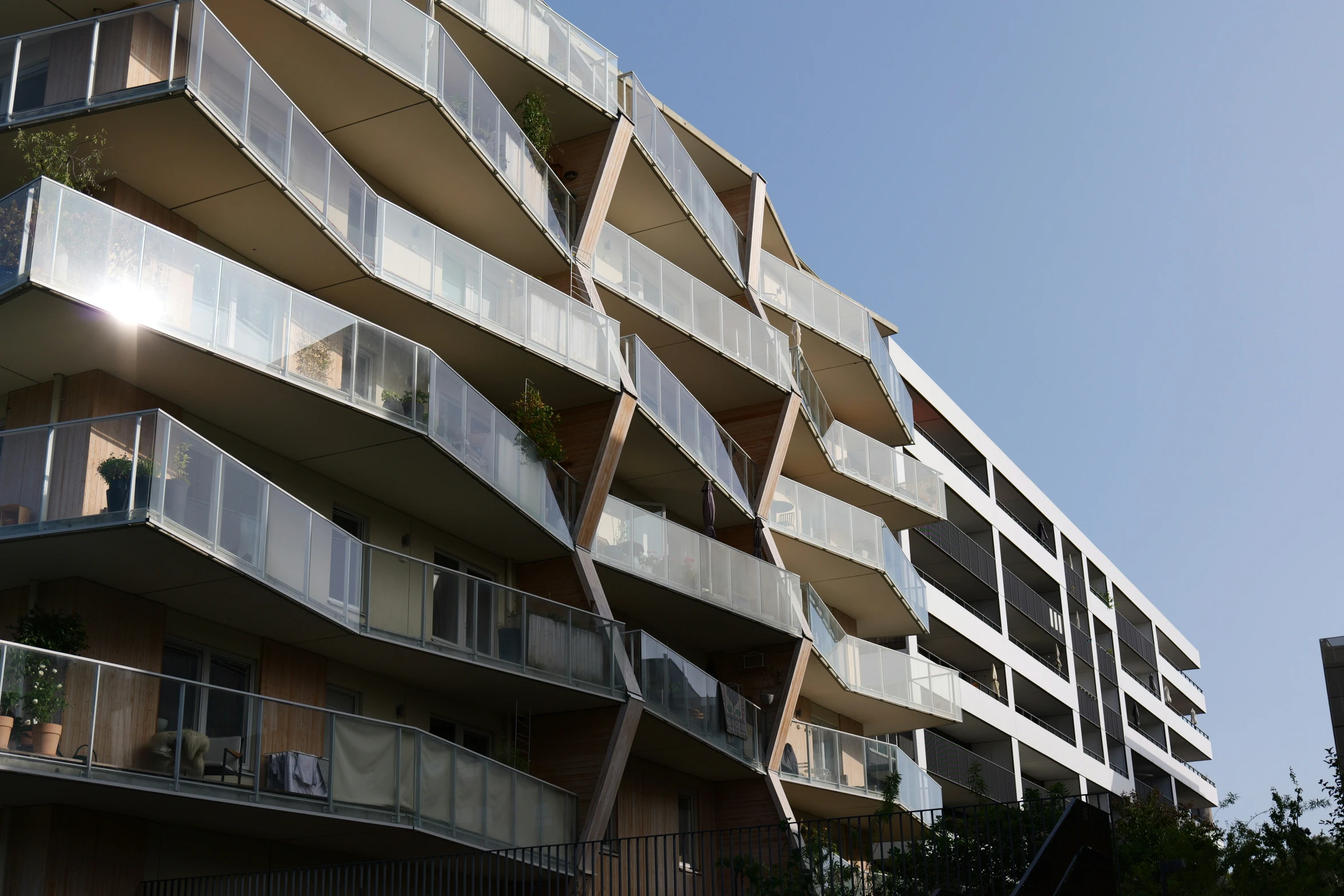 a very tall building with many balconies on it