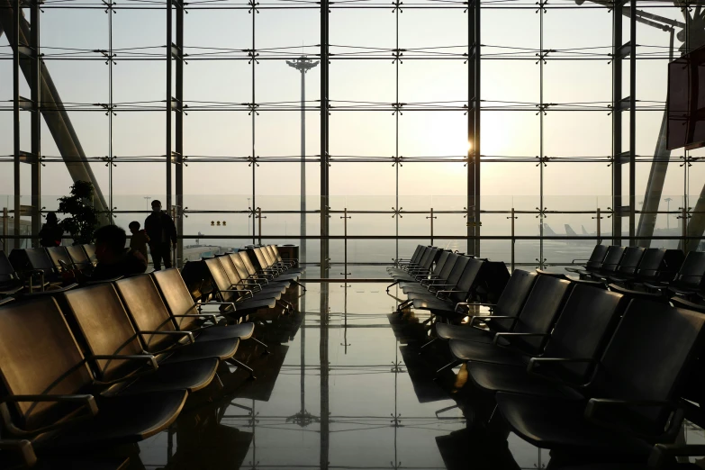 an airport terminal has some empty seats