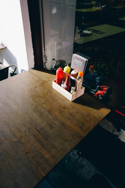 food sits in the holder sitting on a wood counter