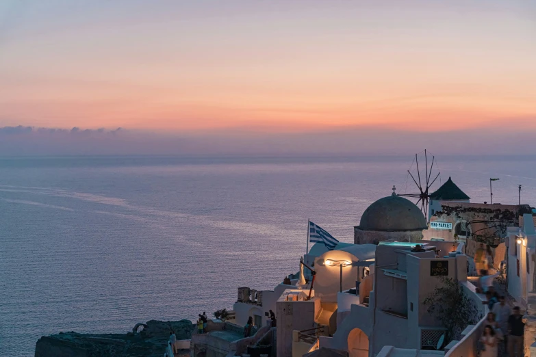 dusk on the ocean and buildings by the water