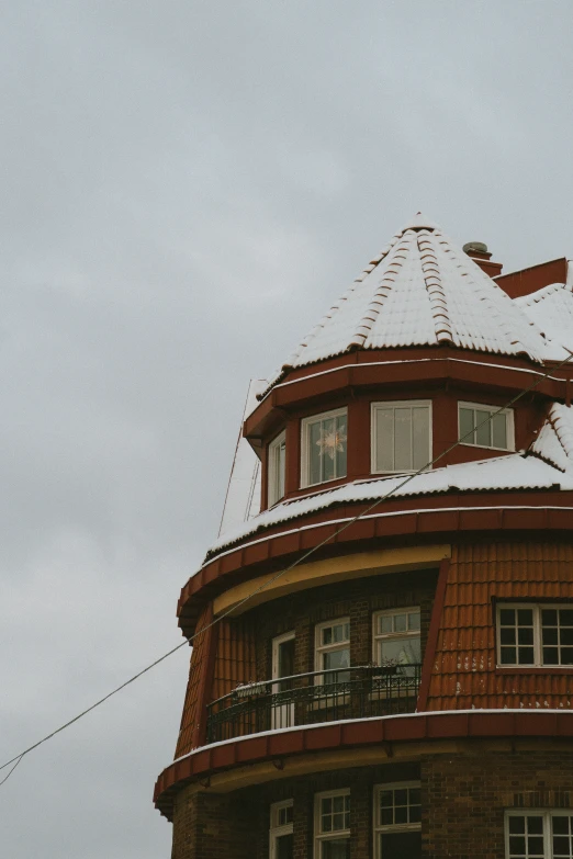 an overcast day with no clouds and a house with some balconies