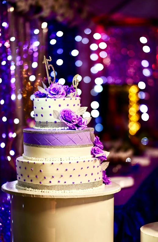 a fancy cake sitting on top of a cake pedestal