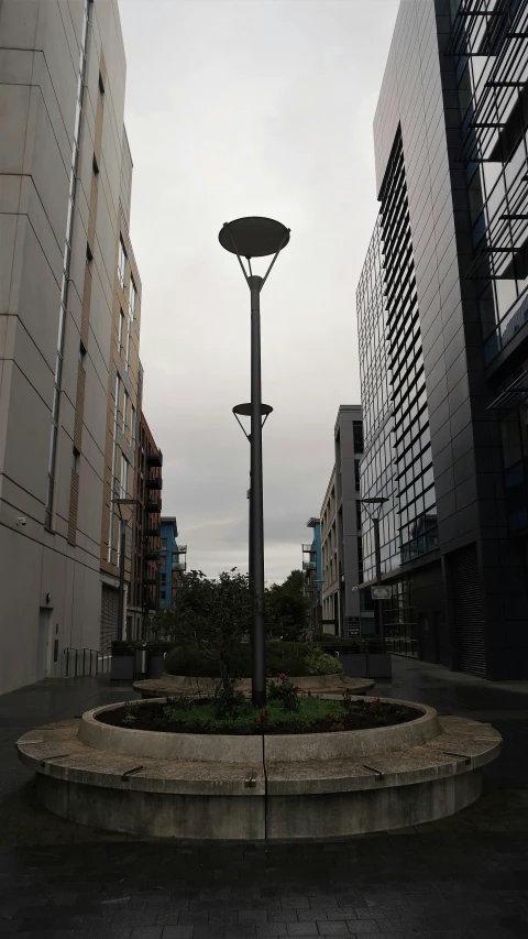 there are two large buildings and a light pole