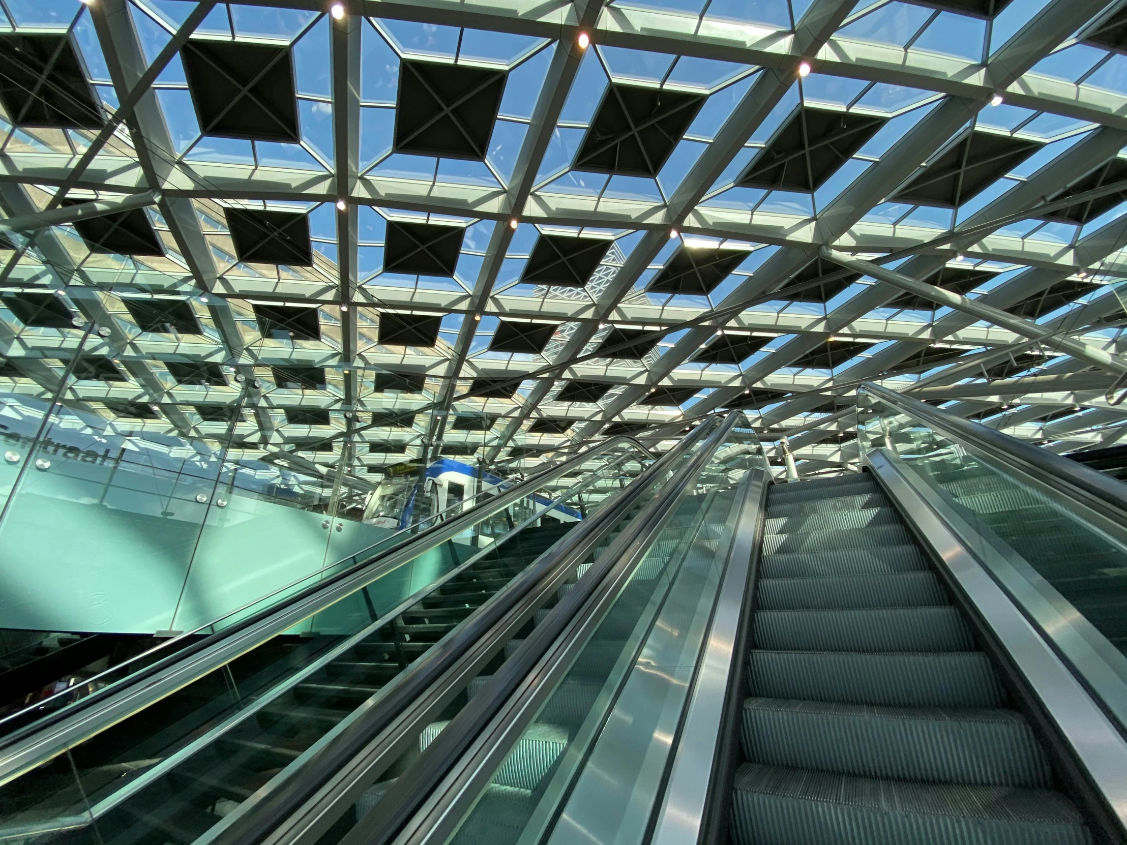 a moving escalator in an empty place with no people