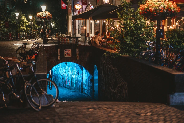 a bridge at night, with a bike leaning up against it