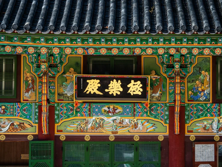 green and red building with oriental decor on top