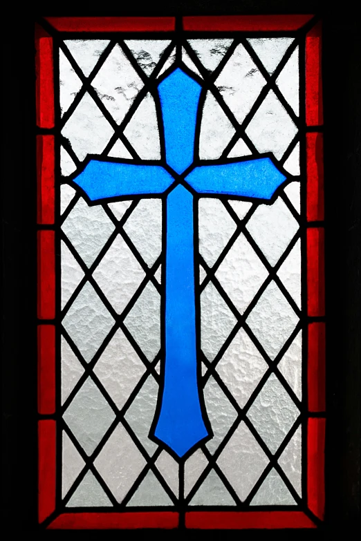 a blue cross painted on top of a glass window