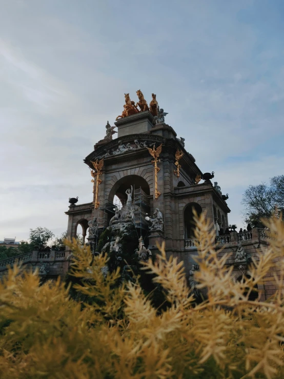 there is a small clock tower surrounded by some trees