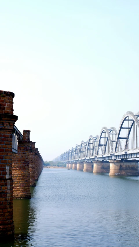 a very large bridge with lots of wires hanging from it