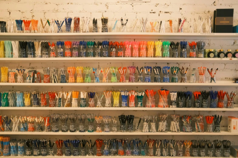 an overflowing collection of colorful, plastic drinking cups