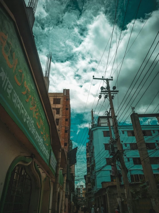 many wires in the sky above some buildings