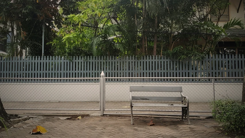 there is a bench and some trash in the dirt