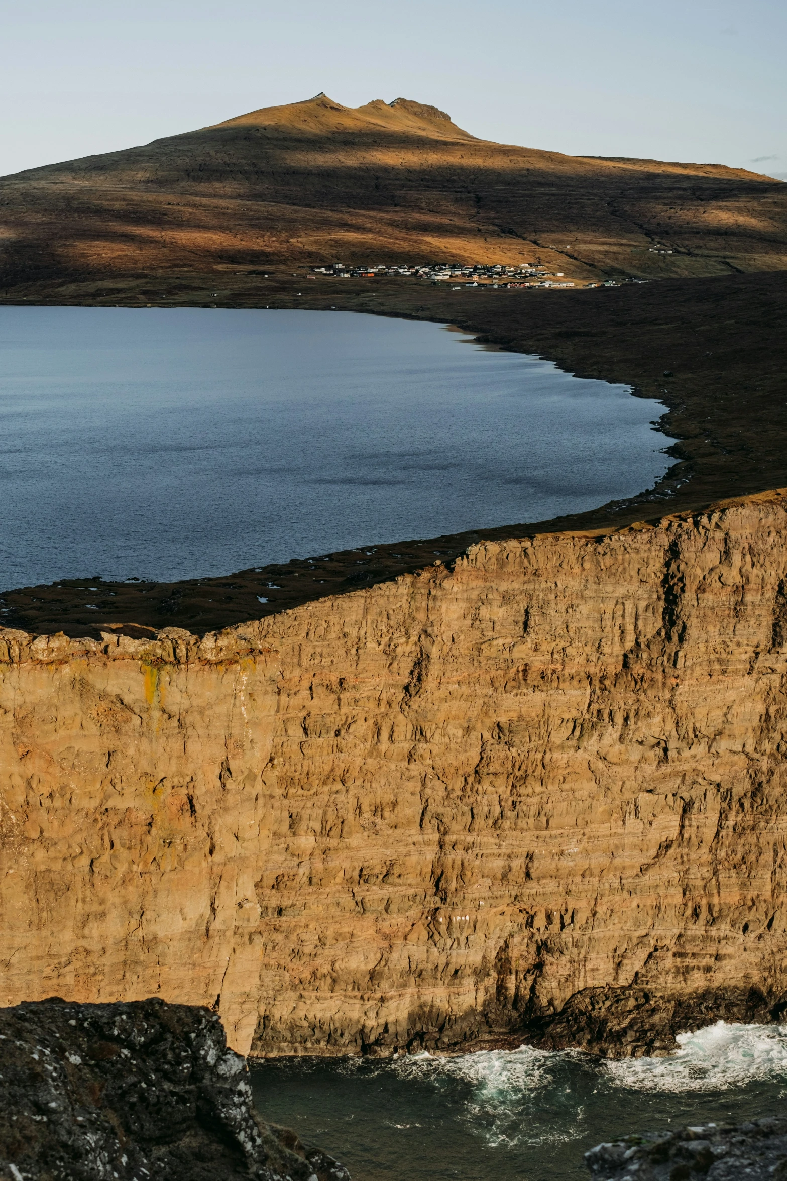 an image of a cliff next to the water