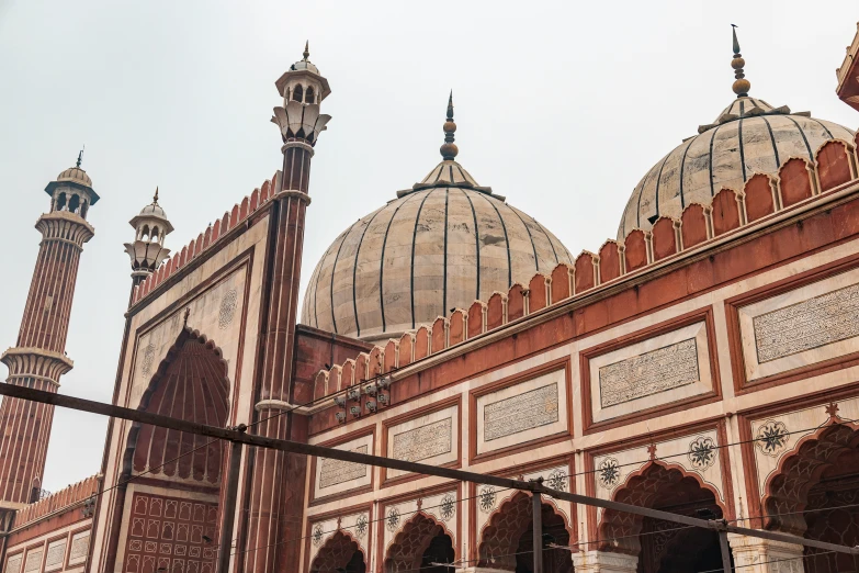 a mosque with white and red painted walls