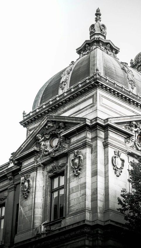 the large building has two clocks on it's roof