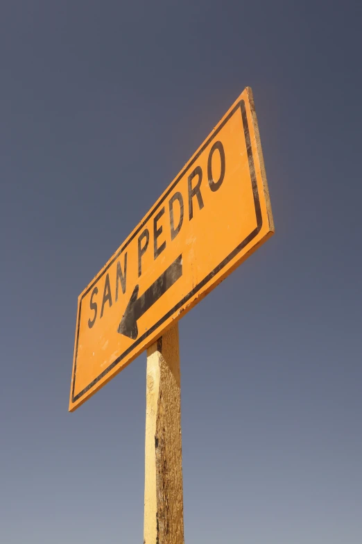 a street sign reading san pedro with the sky in the background