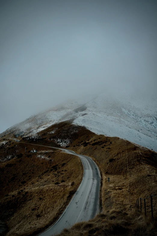 the road leads to the top of the mountain