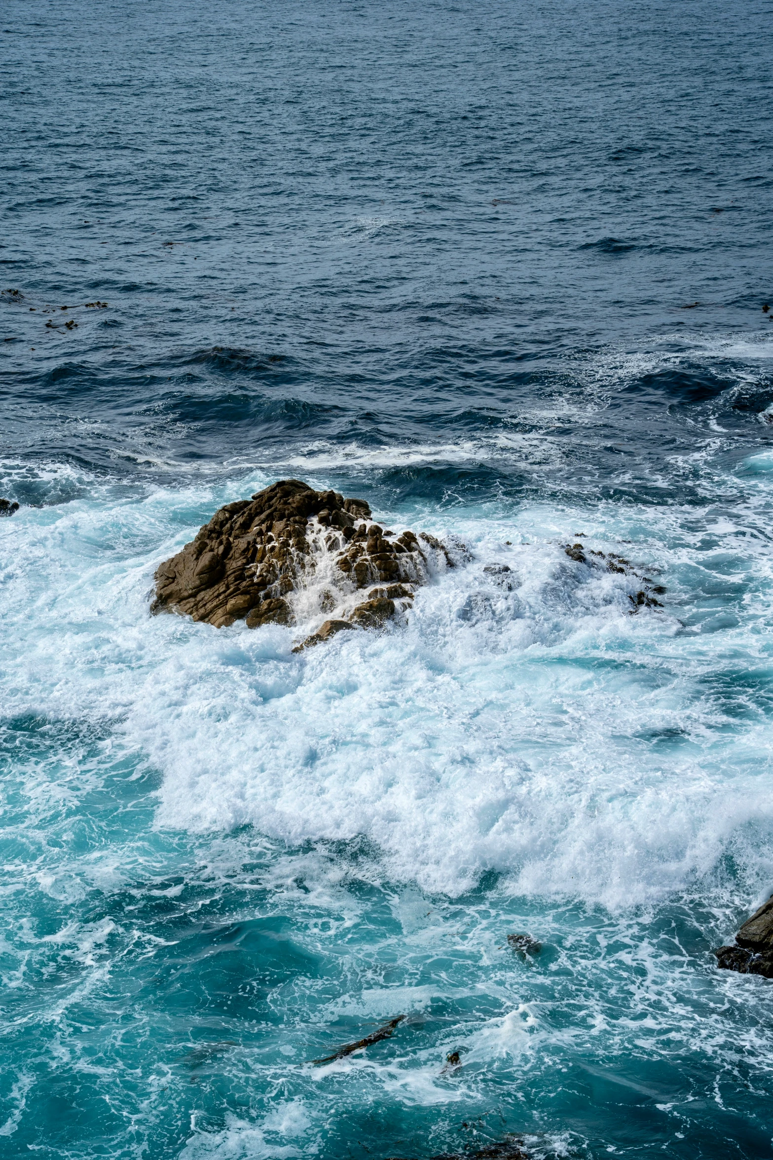 a rocky shore with small waves coming in